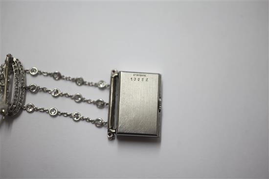 A 1920s rose cut diamond and ruby set staybrite steel Le Coultre lapel watch with diamond set suspension brooch, 55mm.